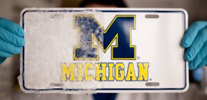 Icephobic coating on license plate
